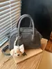 Bolso de Mano Minimalista Boston 2026 Modelo Nuevo Bolso de Bowling de Gama Alta Versátil de Nicho Bolso Cuadrado Pequeño Bolso Cruzado