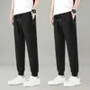 Pantalones deportivos jogger negros de pierna recta para hombre, nuevo estilo de otoño, holgados, a la moda, modernos, adecuados para correr, uso casual y para ir al trabajo.