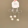 2026 Aretes Sencillos de Perla y Moño Huecos Modernos Elegantes Pinzas para Orejas para Niñas Aretes Únicos Exquisitos Venta al por Mayor para Mujeres