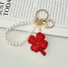 Chaveiro Trevo da Sorte de Quatro Folhas Totalmente Cravejado com Strass Pérola Contas Leve Luxo Versátil Strass Exquisito Pingente de Bolsa Presente