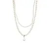 Collar de doble capa con perlas retro francesas, accesorios de cuentas de arroz pequeñas, gargantilla de cadena de clavícula de nicho de lujo ligero de alta gama para mujer