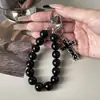 Cadena para teléfono de cruz fundida estilo oscuro, llavero de cordón universal simple y resistente a la suciedad con cuentas, portátil y adecuado para uso transfronterizo