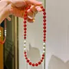 Collar de diseño con perla de agua dulce natural y calcedonia roja