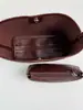 Bolso de hombro tipo cubo grande de capacidad simple para mujer 2026 verano nuevo, tejido de alta costura Shuai Mi Jia, elegante
