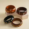Pulseira geométrica de madeira e metal com rebites em formato de estrela, estilo étnico europeu e americano, acessório feminino versátil minimalista de nicho