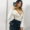 Mono de punto con cuello cruzado de diseño nicho para mujer, nuevo sexy de otoño 2025, ajustado, cuello en V, manga larga