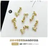 Accesorios para Uñas con Colgante de Cruz Venta Caliente Transfronteriza Estrella Luna Mariposa Aleación Pedrería para Uñas Accesorios DIY Venta al por Mayor