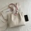 Bolsa de Mão Feminina Textive Simples Suave 2024 Verão Nova Bolsa de Ombro para Trabalho e Dia a Dia Bolsa Tote Tendência