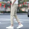 Pantalones de hombre color blanco roto, nuevo modelo otoño 2026, transpirables, ligeros, pantalones casuales, pantalones rectos ajustados para hombre de nueve puntos