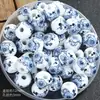 Suministro transfronterizo cuentas de porcelana azul y blanca agujero grande cuentas sueltas material tejido a mano aplique de cuentas cerámicas joyería pequeña DIY al por mayor