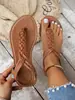 Suministro transfronterizo 2026 nuevo modelo sandalias de chancla para mujer, sandalias tejidas planas de talla grande para mujer, zapatos de moda estilo romano