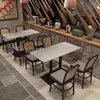 Nueva Combinación de Mesa de Comedor de Roca Laminada y Cabaña Tejida de Ratán Chino Mesa y Silla para Casa de Té Restaurante de Té Combinación de Mesa y Silla para Casa de Té