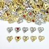 Joyería para uñas estilo lujo ligero amor hueco joyería de aleación aleación roja día de san valentín joyería para uñas accesorios al por mayor