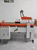 Máquina selladora de cartón en forma de cruz máquina de empaque automático máquina de empaque exprés enrollado de cinta cruzada máquina selladora de enrollado de círculo completo