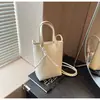 2025 Nicho Color Sólido Bolso Popular Moda Nueva para Mujer Moda Un Solo Hombro Sencillo Cruzado Viajero Bolsa para Teléfono Móvil