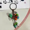 Chaveiro de Cerâmica de Jingdezhen Pêssego Pequeno Fresco Pendurador de Bolsa Estilo Ins Joias de Feira Literárias e Fofas Fornecedor Fabricante