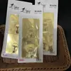 R190 gancho adhesivo dorado gancho adhesivo para el hogar diario gancho de baño cocina gancho sin perforaciones un yuan 2 paquetes