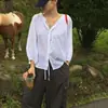 Enviado. Camisa chic coreana de corte holgado y manga larga para mujer, nuevo top casual de principios de otoño 2026