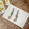Aretes de aguja plateada con diamantes, flecos y perlas, que ofrecen una sensación de lujo ligero y sofisticado, aretes de moda y exquisitos, de nicho y versátiles, aretes elegantes para mujer