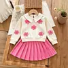Conjunto de moda para niña de 26 piezas: Top de tela texturizada con cuello, bordado de lazo + Falda corta plisada de línea A