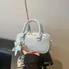Bolsa de Bolos de Mano para Mujer 2026 Primavera Nueva Bolsa para Mujeres de Uso Diario Alta Apariencia Elegante de un Solo Hombro Cruzada Pequeña Cuadrada