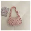 Nova bolsa de mão estilo coreano com laço em forma de coração, design de nicho, versátil para o trabalho, bolsa de ombro plissada de veludo cotelê para usar sob o braço