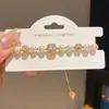 Pulsera de Perlas y Circonia Cuadrada Chapada en Oro Real de 18k Anillo de Mano de Lujo Ligero y Alta Gama Joyería de Mano Moderna y Versátil para Mujeres