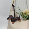 Colgante de Perro Salchicha Nuevo Transfronterizo Dibujos Animados Colgante de Bolsa de Cachorro de Cuero Accesorios para Funda de Teléfono Móvil Accesorios Creativos para Coche