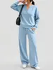 Conjunto deportivo casual de dos piezas para mujer, otoño e invierno 2026, transfronterizo europeo y americano, nuevo diseño de moda, top holgado de manga larga y pantalón de pierna ancha
