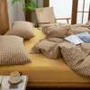 Juego de cuatro piezas de algodón 100% teñido en hilo y lavado, algodón puro, sin marca, suministrado por el fabricante, funda de edredón de alta calidad, sábana bajera de estilo japonés, ropa de cama al por mayor