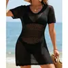 Ropa de mujer estilo europeo y americano nueva, sexy con huecos, manga corta, casual, cubierta de bikini para traje de baño, cubierta para la playa, camisa de protección solar