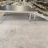 Armazón de Truss para Escenario de Aleación de Aluminio Personalizado Hebilla Rápida para Escenario Elevador Pasarela de Boda Escenario en T Instalación Rápida Celebración Fabricante