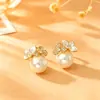 Pendientes populares de flor y perla de moda, de alta gama, elegantes, con diseño único, pendientes de nicho para mujer