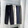 Pantalones de Moda Sencillos de Color Sólido para Hombre Primavera/Verano Ajuste Holgado Cintura Elástica Nueva Diseño Minimalista Versátiles de Pierna Recta Pantalones Casuales