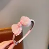 Diadema de tela con diseño de conejito de dibujos animados y flor, con dientes, antideslizante, adecuada para niños, versátil, no daña el cabello, accesorio para el cabello