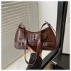 2025 Moda Remache Simple Primavera Nueva Moda Estilo Occidental Diseño Personalizado Bolso de Hombro Cruzado Axilar para Mujer