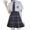 2024 nueva colección japonesa uniforme JK falda a cuadros traje de manga corta para mujer falda plisada uniforme escolar jk para estudiante venta al por mayor generación