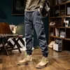 Pantalones de trabajo lavados al agua marca de moda pantalones de chándal desgastados para hombre peso pesado retro casual pantalones para hombre con puños forrados de forro polar pantalones largos de senderismo