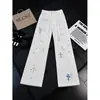 Jeans de verano rotos con bordado de pedrería y diseño de cruz, unisex, marca de moda americana de alta calle, corte holgado, pantalones rectos ligeramente acampanados