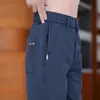 Pantalones casuales de seis bolsillos, estilo fino para primavera y otoño, cintura semi-elástica para hombre, versátiles para jóvenes y de mediana edad, pantalones rectos holgados de negocios al por mayor