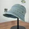 Chapéu de pescador de brim largo estilo coreano para primavera/verão, proteção solar para o rosto, design de nicho ins, jeans lavado para mulheres com elástico atrás, moderno e estiloso