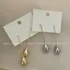 Pendientes de Diseño de Nicho de Lujo Ligero Estilo Francés Personalidad Minimalista Moda Tendencia Genial Pendientes de Gota de Agua Pendientes de Botón de Alta Gama