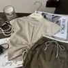 Ropa Infantil Estilo Coreano Nuevo Modelo 2026 Verano Conjunto de Dos Piezas para Niñas Camiseta con Estampado de Letras y Mangas Acampanadas con Pantalones de Falda Bordados de Patchwork Moderno