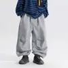 Pantalones largos para niño, nueva colección otoño 2026, pantalones casuales de color liso estilo coreano, corte holgado, adecuados para niños pequeños y mayores, con puños elásticos, versátiles