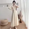 Vestido Tricot Manga Longa Suave Feminino Outono Inverno 2025 Novo Decote V Cintura Marcada Emagrecedor Abaixo do Joelho Vestido Suéter