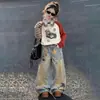 Conjunto de Camiseta de Manga Longa e Jeans para Meninas Roupa de Primavera e Outono Infantil 2026 Novo Estilo Roupa de Baixo para Meninas Conjunto de Duas Peças Calças Longas