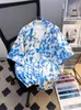 Camisa de Praia Floral Azul de Verão Estilo Sanya Hawaii Férias Preguiçosa Retro Solta Camisa para Casal