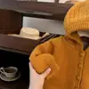 ¡Nuevo terciopelo cálido de invierno de la dulce Xiaosi! Ropa Infantil Coreana Niña Pequeña Ganchillo Calado Tejido de Punto Engrosado Ropa de Punto con Capucha
