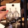 Brincos de gota de água vazada para mulheres, brincos elegantes de celebridades da Internet, borla, joias longas e distintas para orelha