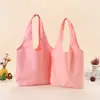 Suministro directo transfronterizo de bolsas de lona de colores lisas listas para usar, bolsas de lona tipo tote multicolor, bolsos de hombro de gran capacidad para el trabajo